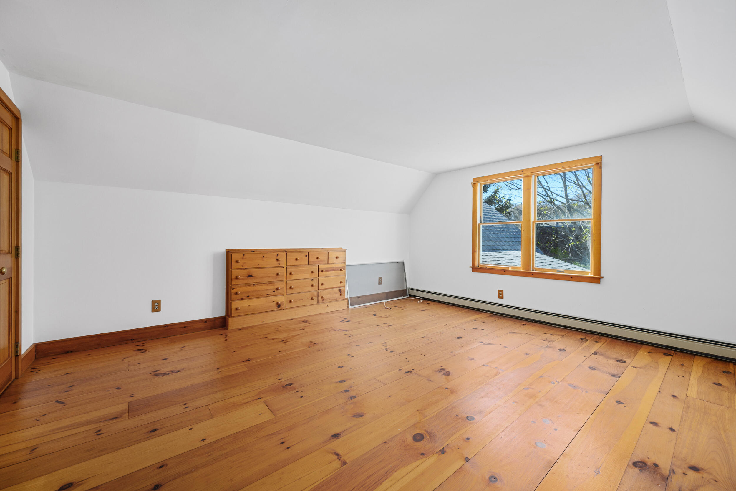 181 Elliott Road Centerville, MA 02632 - Photo 33 of 60 an empty room with wooden floor and windows