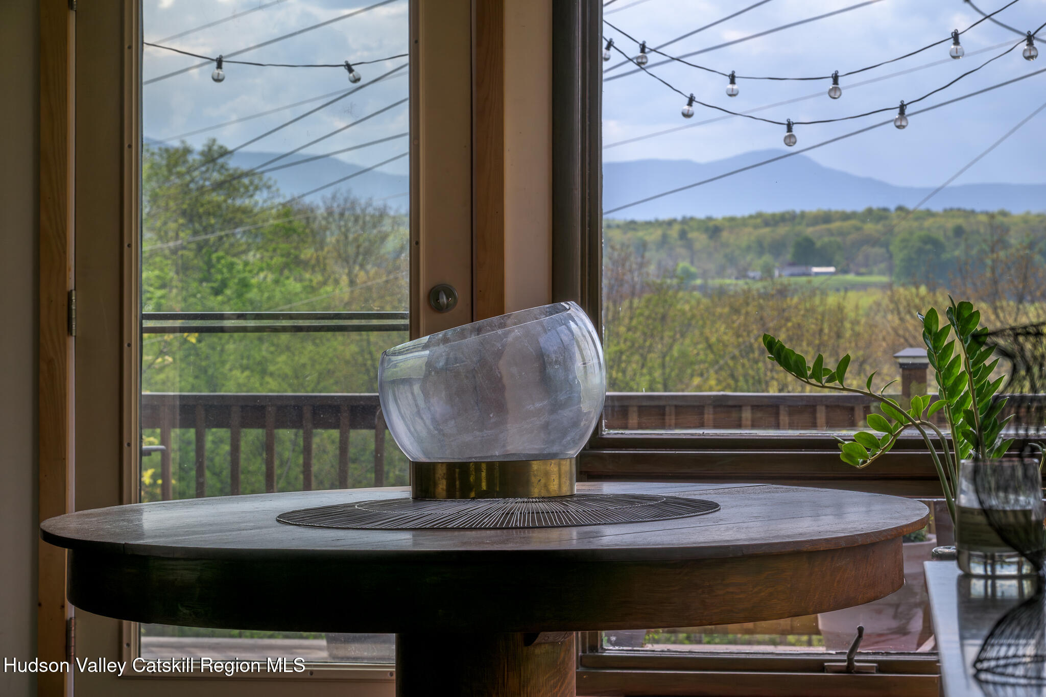 29 Edgemere Hill Road Catskill, NY 12414 - Photo 15 of 38 a view of a balcony with table and chairs