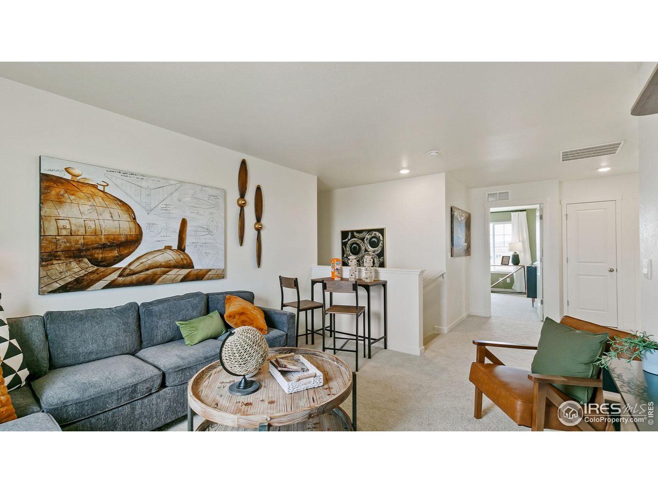942 London Way Severance, CO 80550 - Photo 16 of 26 a living room with furniture and kitchen view