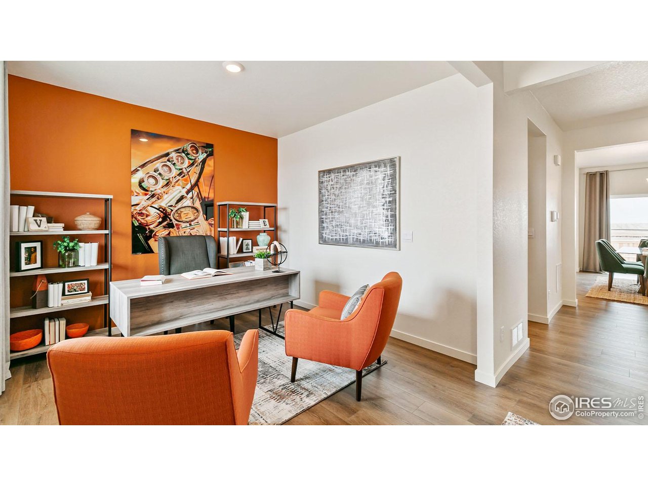 942 London Way Severance, CO 80550 - Photo 2 of 26 a living room with furniture and a book shelf
