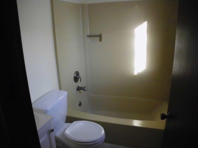 89 Pimlico Pond Road Mashpee, MA 02649 - Photo 7 of 14 a white toilet sitting next to a bath tub