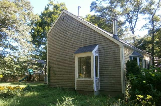 89 Pimlico Pond Road Mashpee, MA 02649 - Photo 10 of 14 a view of a house with a yard
