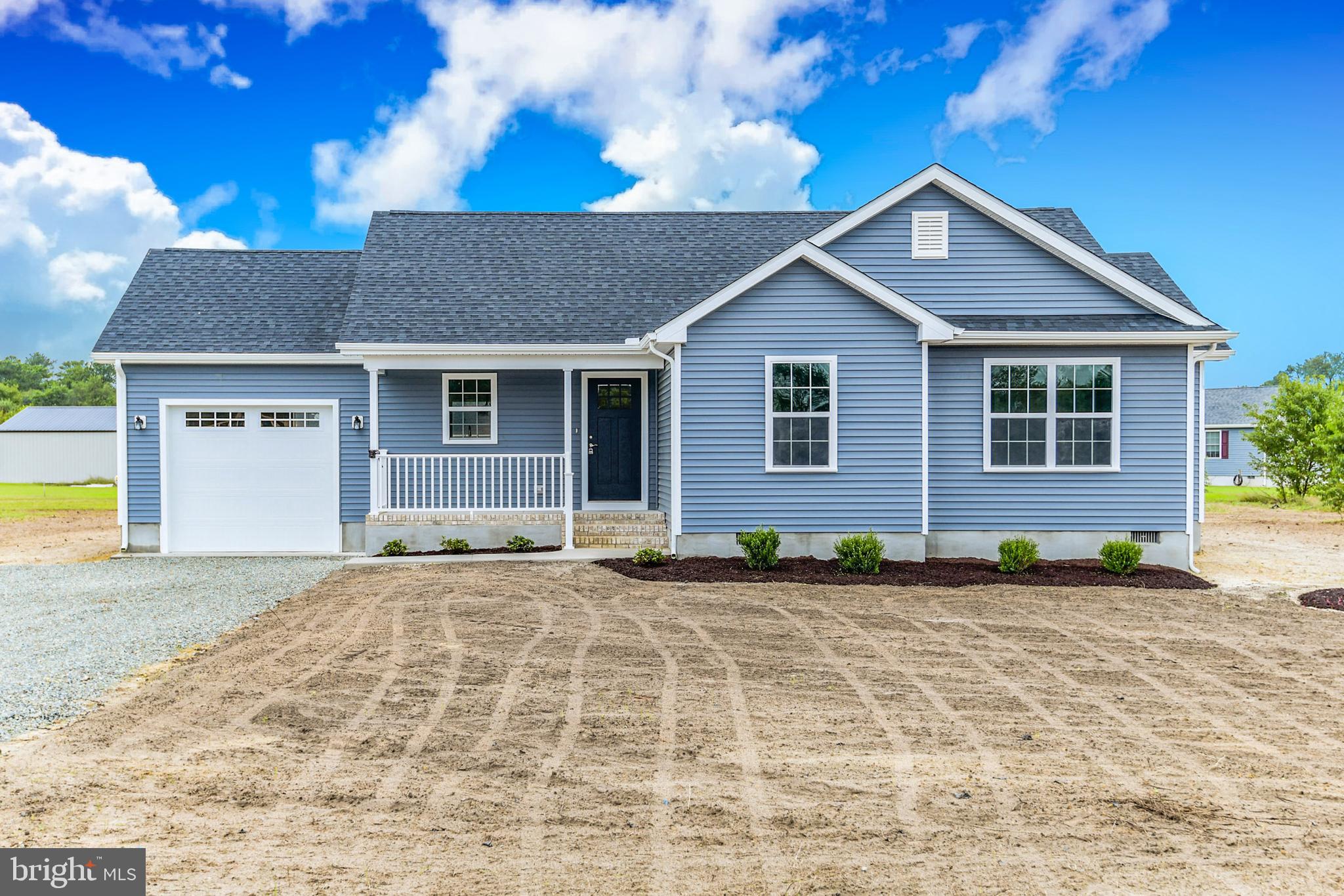 153 Fooks Road Bishopville, MD 21813 - Photo 1 of 30 a front view of a house with a yard