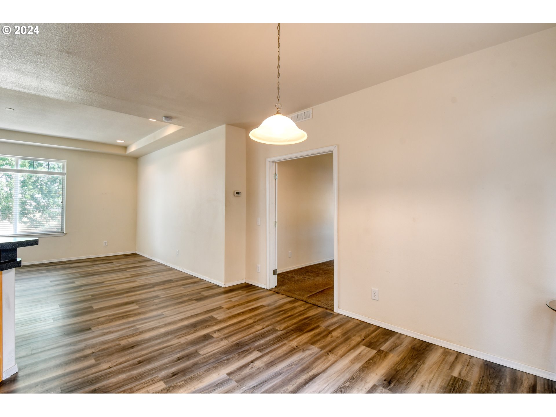 45457 Trail Road Pendleton, OR 97801 - Photo 7 of 48 a view of an empty room with wooden floor and a window