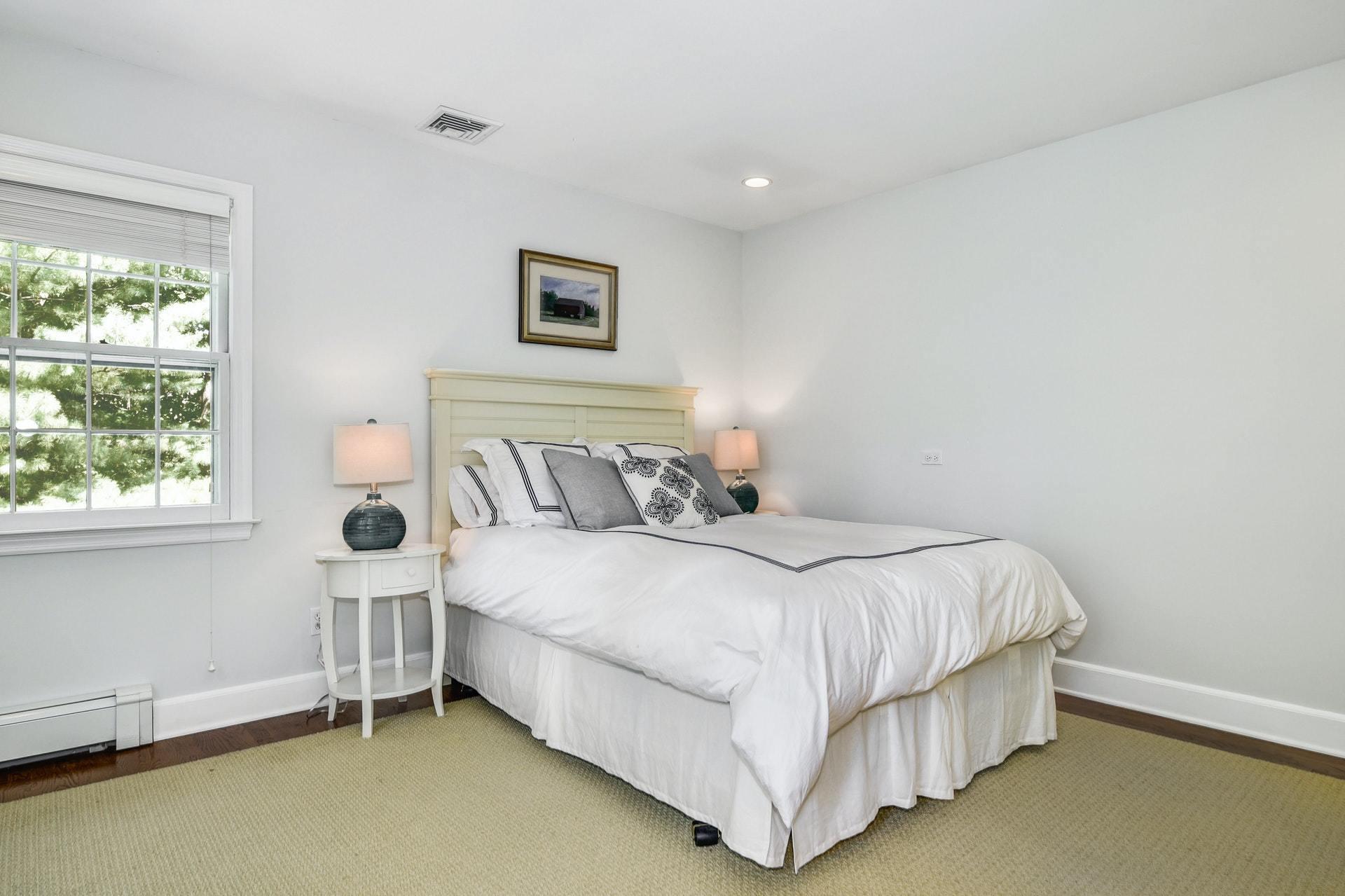 32 Delafield Island Road Darien, CT 06820 - Photo 23 of 34 a bedroom with a bed and window