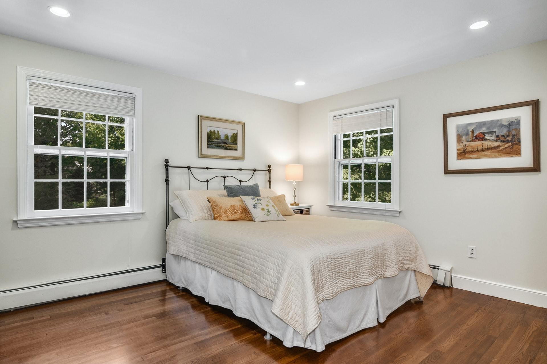 32 Delafield Island Road Darien, CT 06820 - Photo 25 of 34 a bedroom with a bed and windows