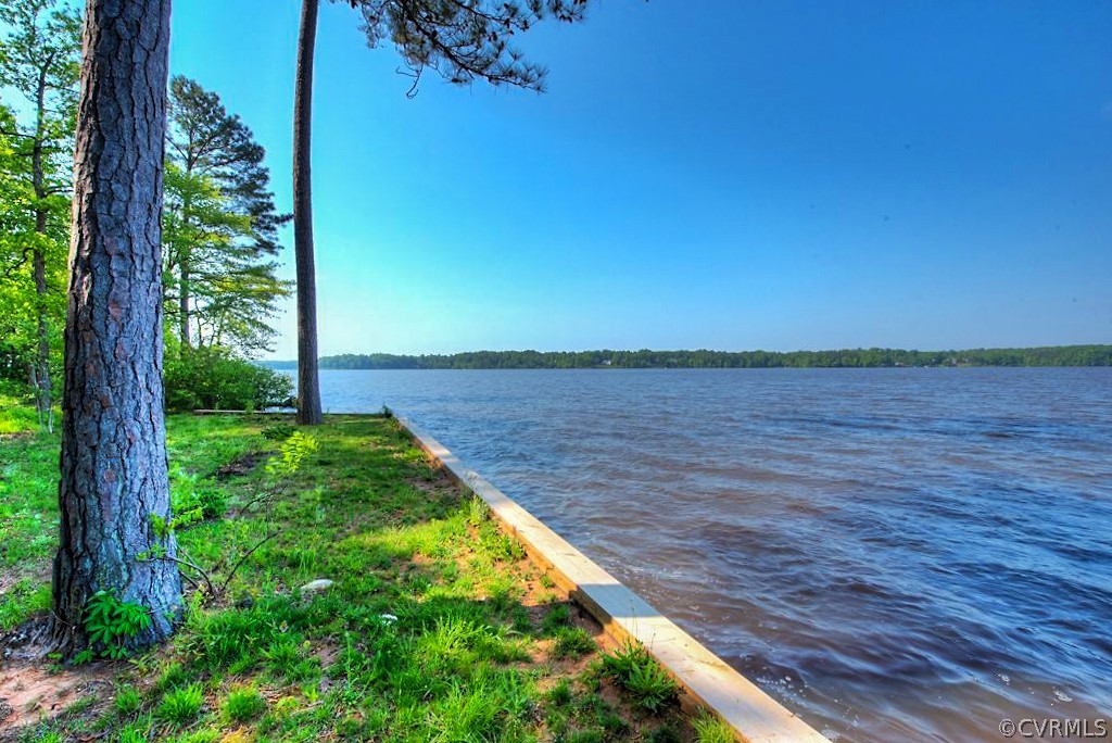 3506 Walkers Ferry Road Midlothian, VA 23112 - Photo 4 of 50 a view of a lake with a house in the background