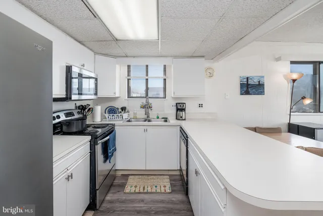 a view of hallway with wooden floor