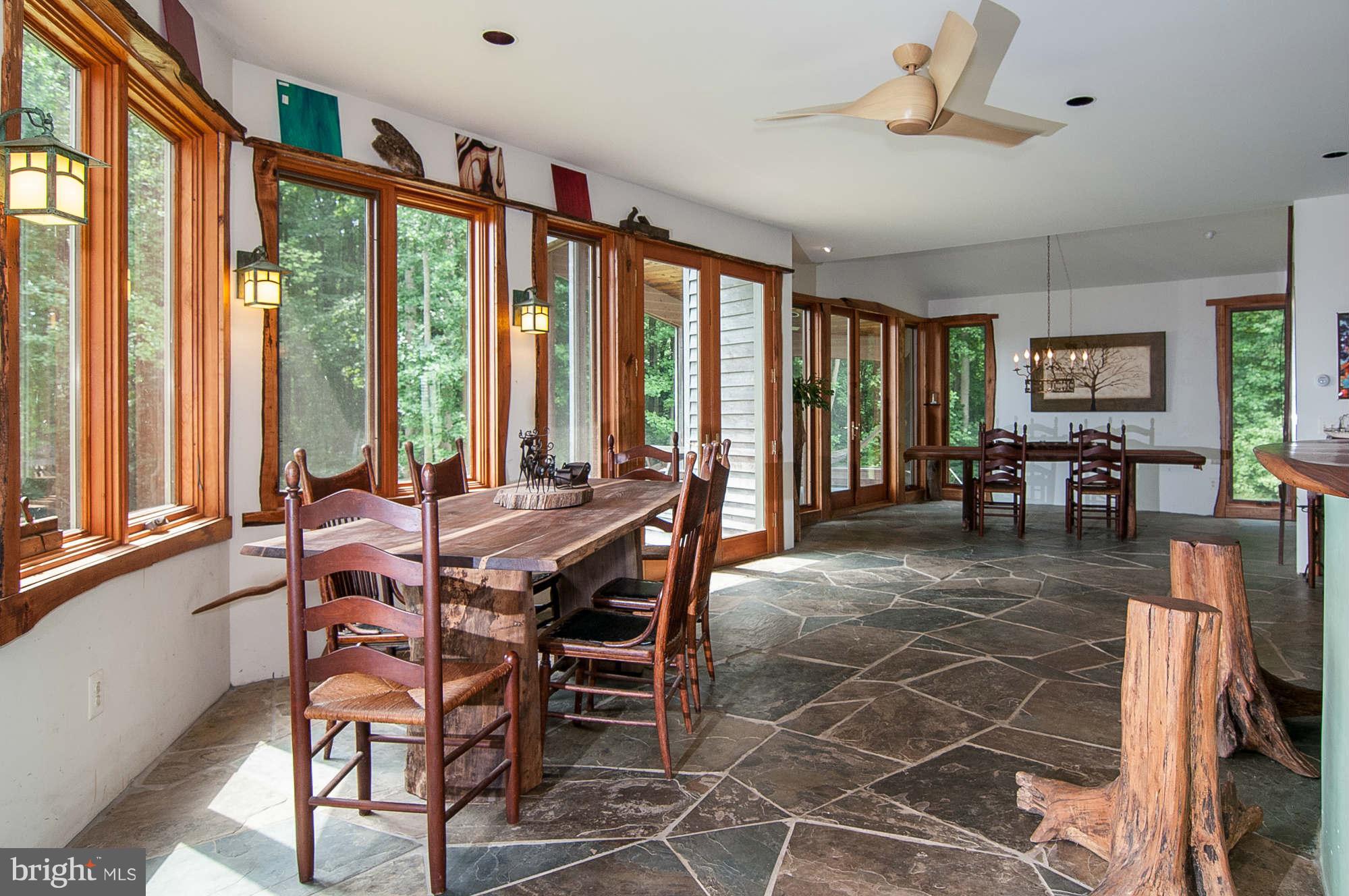 347 Fairhaven Road Tracys Landing, MD 20779 - Photo 16 of 26 a view of a dining room with furniture window and outside view