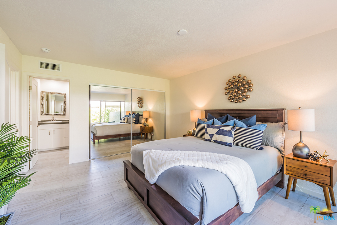 1111 East Ramon Road, Unit 8 Palm Springs, CA 92264 - Photo 12 of 36 a bedroom with a bed and furniture