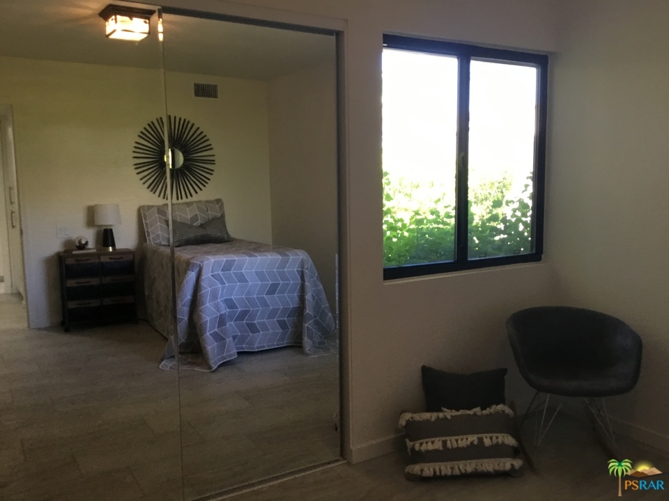 1111 East Ramon Road, Unit 8 Palm Springs, CA 92264 - Photo 22 of 36 a living room with furniture and a window