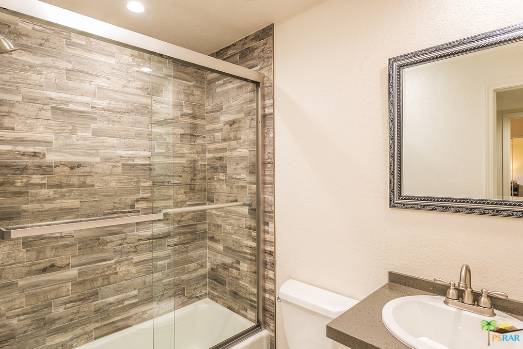 1111 East Ramon Road, Unit 8 Palm Springs, CA 92264 - Photo 24 of 36 a bathroom with a shower and a sink