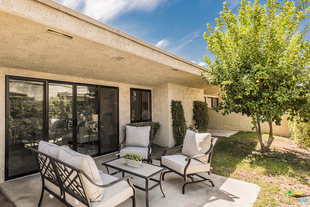 1111 East Ramon Road, Unit 8 Palm Springs, CA 92264 - Photo 32 of 36 a building outdoor space with patio furniture
