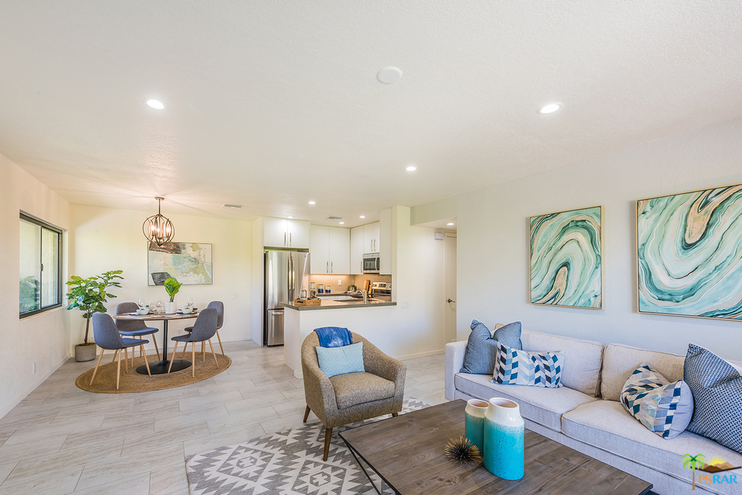 1111 East Ramon Road, Unit 8 Palm Springs, CA 92264 - Photo 5 of 36 a living room with furniture and kitchen view