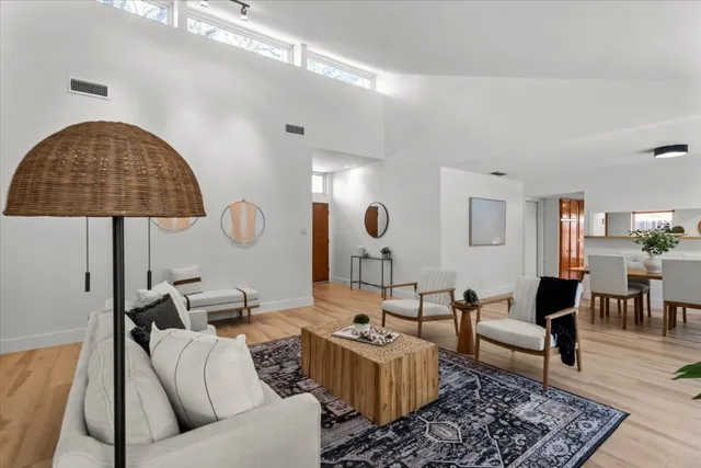 a living room with furniture and a table