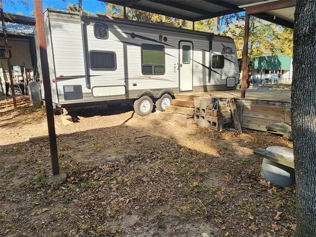 a view of a backyard with a patio