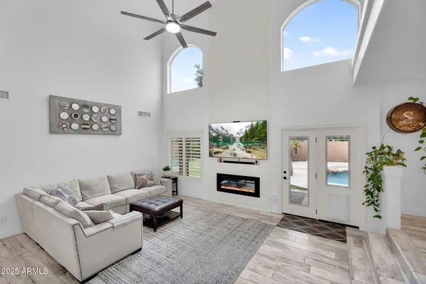 a living room with furniture and a fireplace