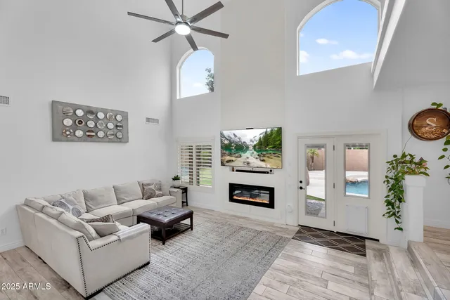 a living room with furniture and a fireplace