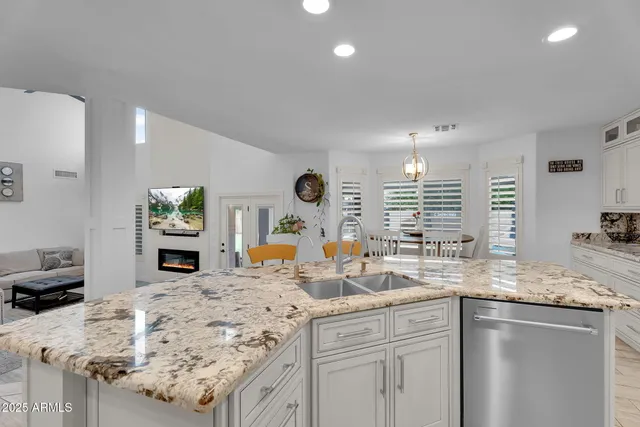 a dining room with furniture window and wooden floor