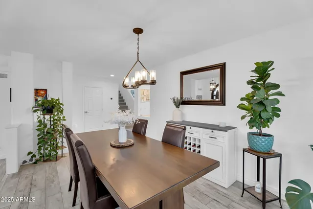 a living room with furniture and a ceiling fan