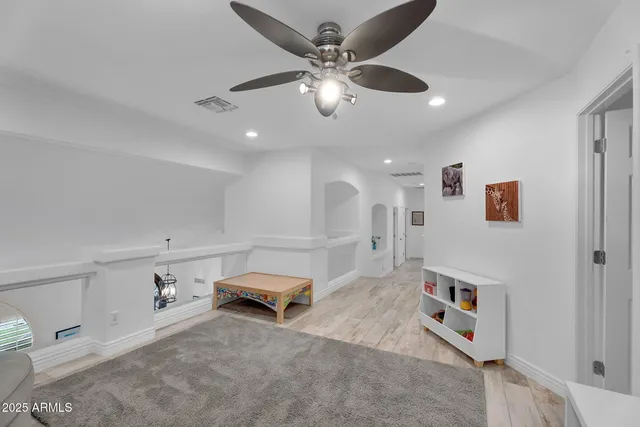 a bathroom with a bathtub a window and a shower