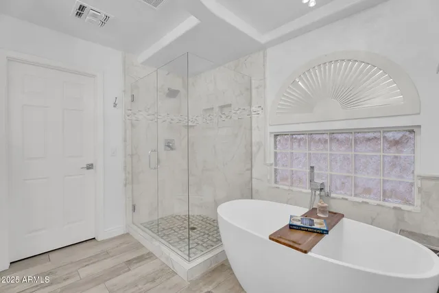 a bedroom with furniture and a window