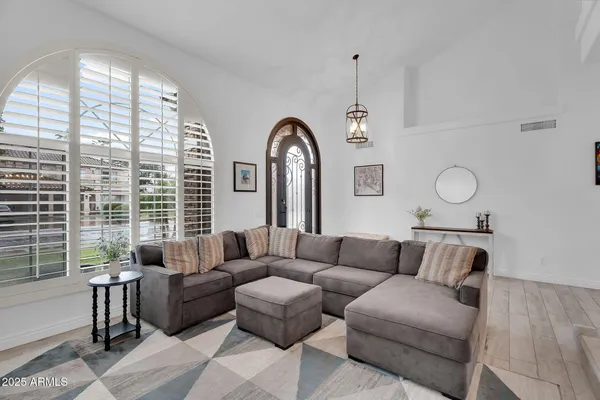 a living room with furniture and a large window