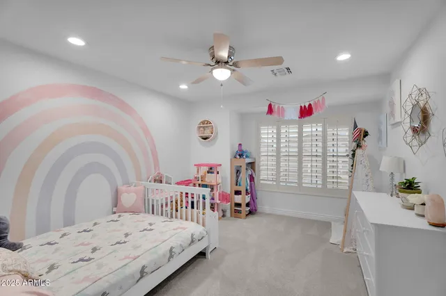 a view of a garden with a building in the background