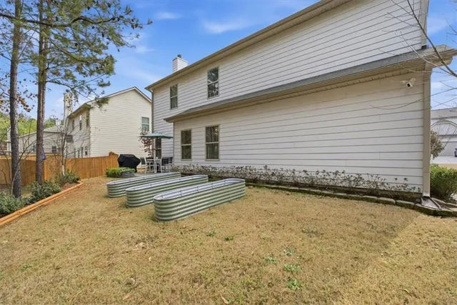a view of a patio with swimming pool table and chairs