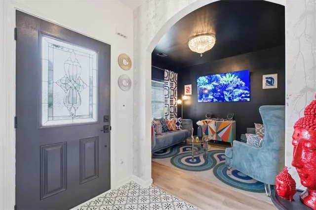 a living room with furniture and a flat screen tv