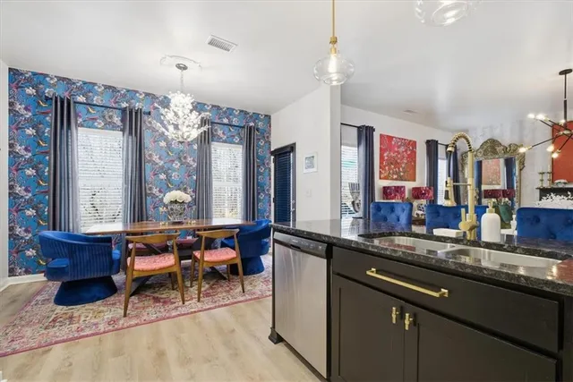 a kitchen with a sink and a refrigerator