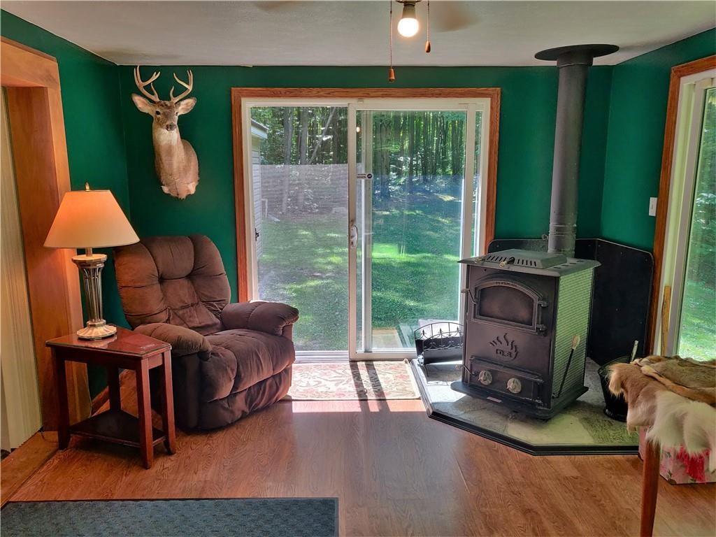 6173 Philadelphia Road Springboro, PA 16435 - Photo 16 of 25 a living room with furniture and a fireplace