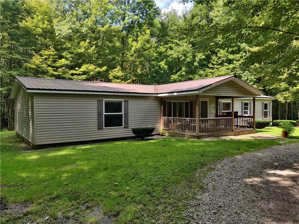 6173 Philadelphia Road Springboro, PA 16435 - Photo 25 of 25 a front view of a house with yard patio and green space