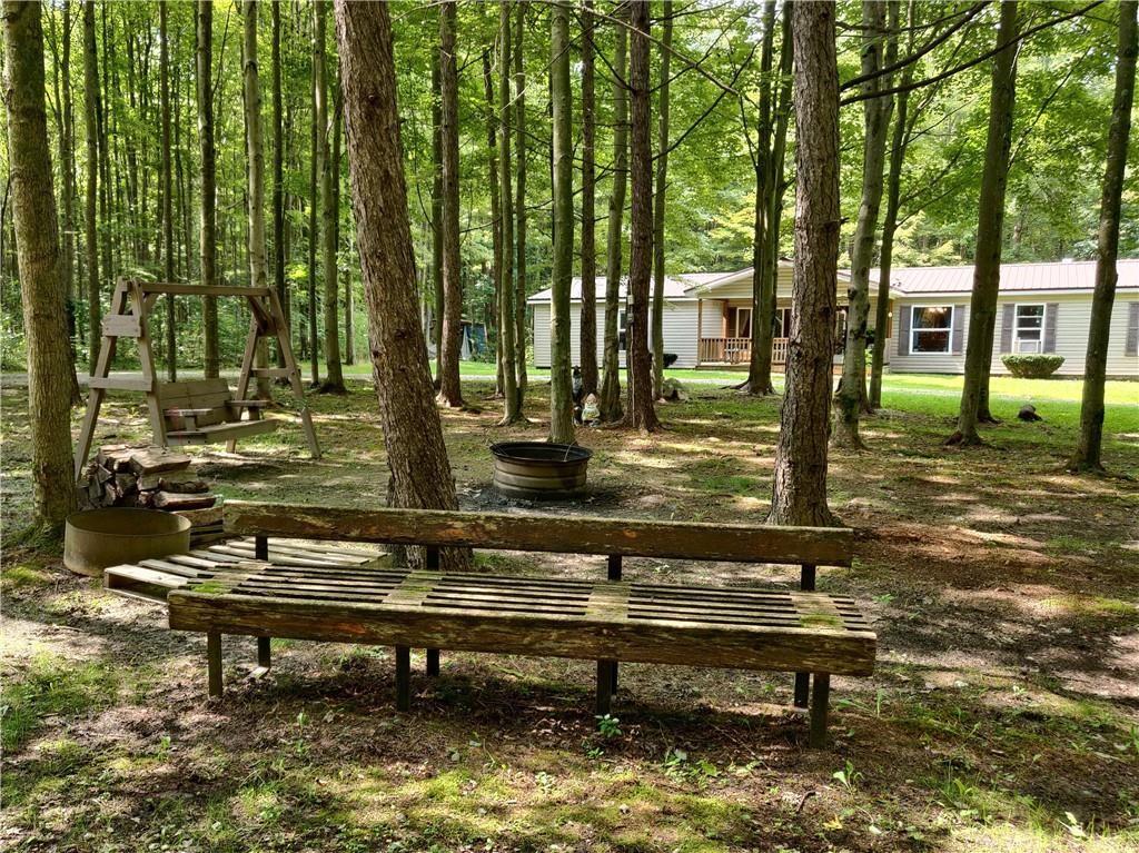 6173 Philadelphia Road Springboro, PA 16435 - Photo 5 of 25 a view of swimming pool with outdoor seating and trees