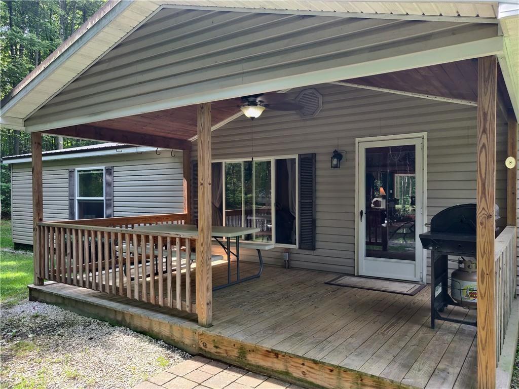 6173 Philadelphia Road Springboro, PA 16435 - Photo 6 of 25 a view of a house with a porch