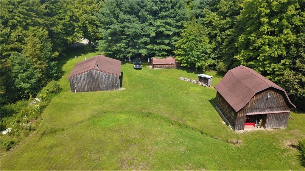 6173 Philadelphia Road Springboro, PA 16435 - Photo 8 of 25 an aerial view of a house with garden space and trees