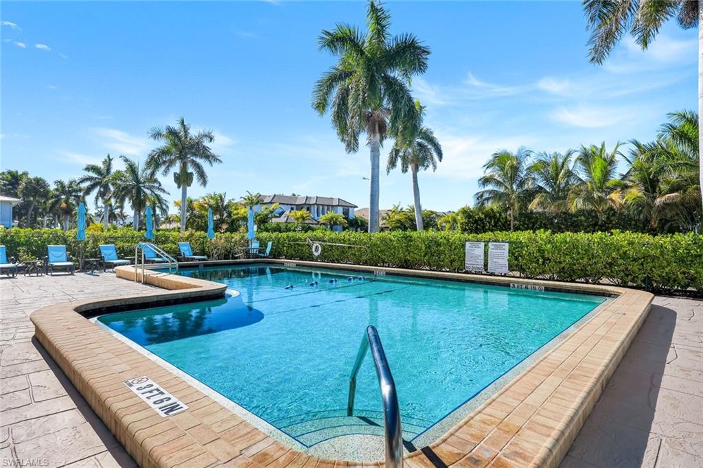 4200 Belair Lane, Unit 316 Naples, FL 34103 - Photo 18 of 18 a view of swimming pool with a patio
