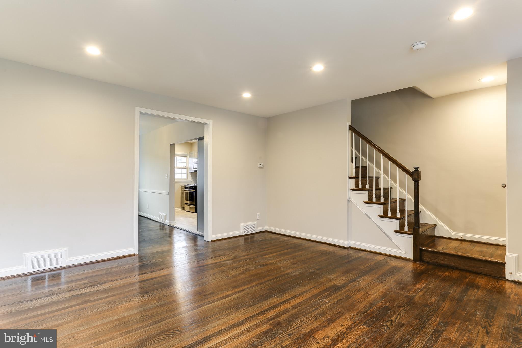 1425 Kitmore Road Baltimore, MD 21239 - Photo 14 of 23 a view of an entryway with wooden floor
