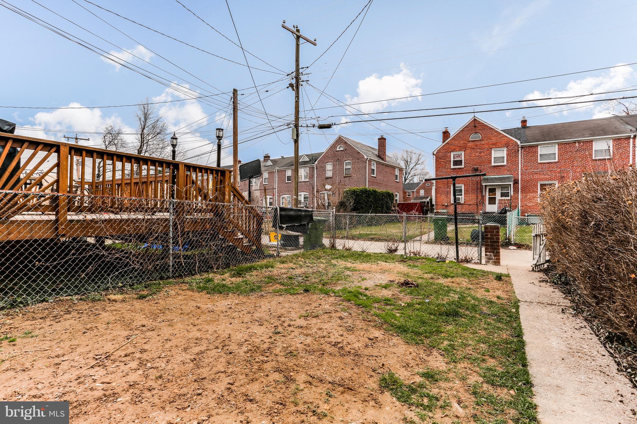 1425 Kitmore Road Baltimore, MD 21239 - Photo 22 of 23 a view of a large apartment building in the background