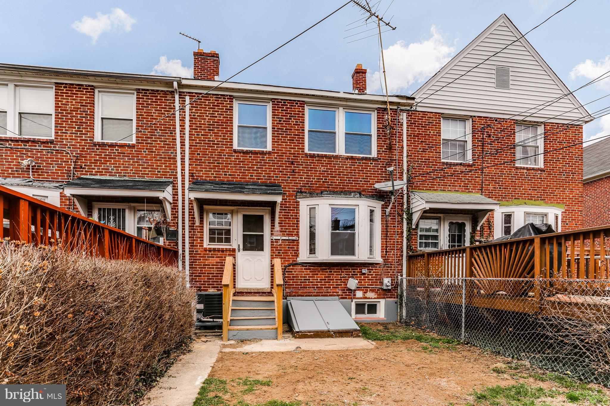 1425 Kitmore Road Baltimore, MD 21239 - Photo 23 of 23 a front view of a house with a yard