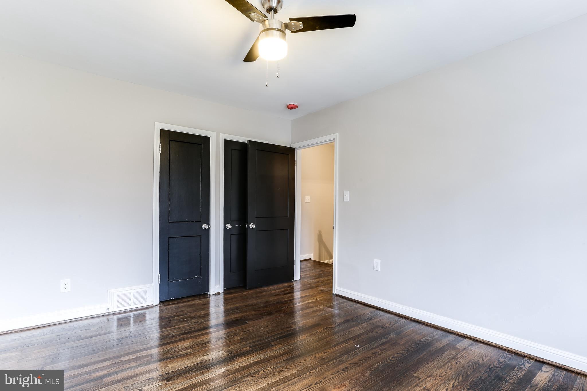 1425 Kitmore Road Baltimore, MD 21239 - Photo 8 of 23 a view of an empty room with wooden floor