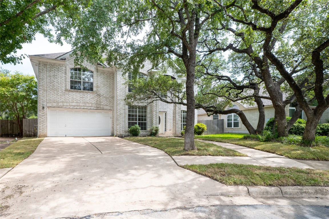 2437 Cloud Peak Lane Round Rock, TX 78681 - Photo 1 of 1 a front view of a house with a yard and trees