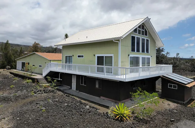 a front view of house with yard outdoor seating and barbeque oven