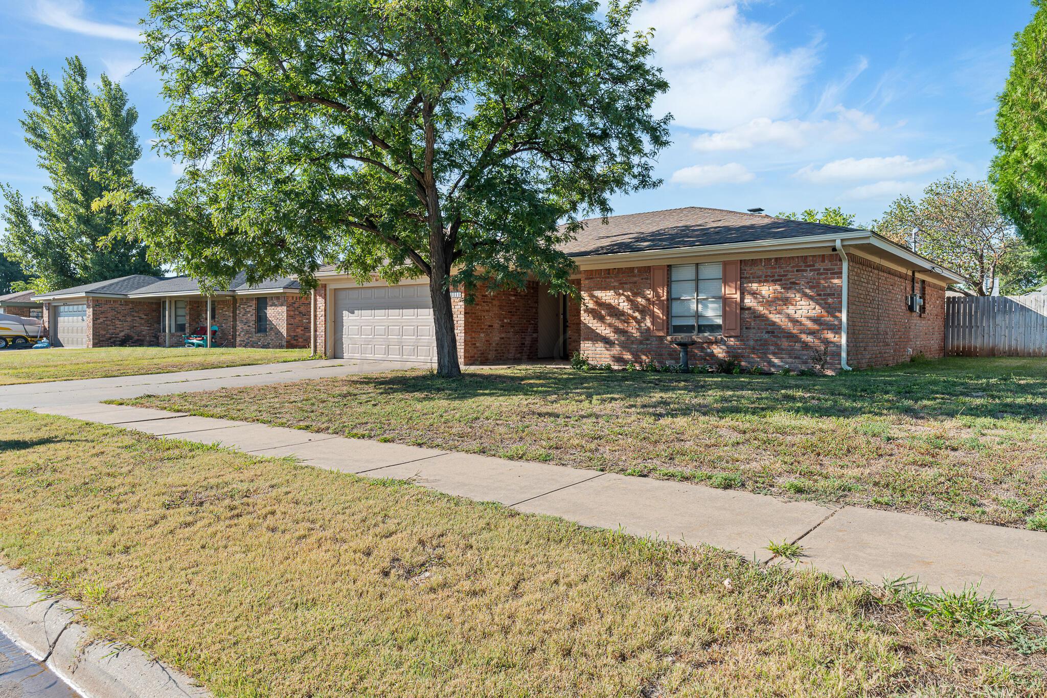 6212 Rutgers Street Amarillo, TX 79109 - Photo 1 of 26 a view of a house with a yard