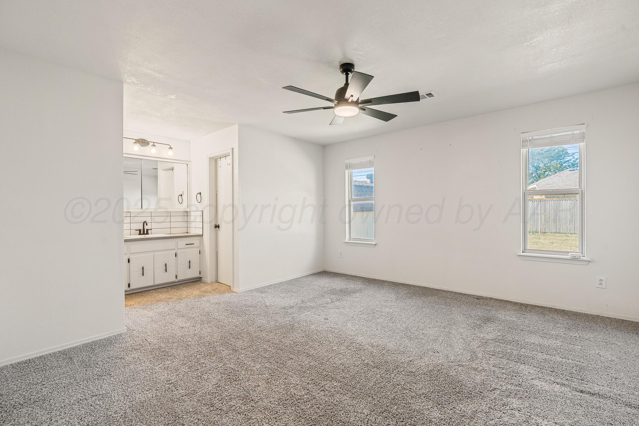 6212 Rutgers Street Amarillo, TX 79109 - Photo 12 of 26 a view of an empty room with a window