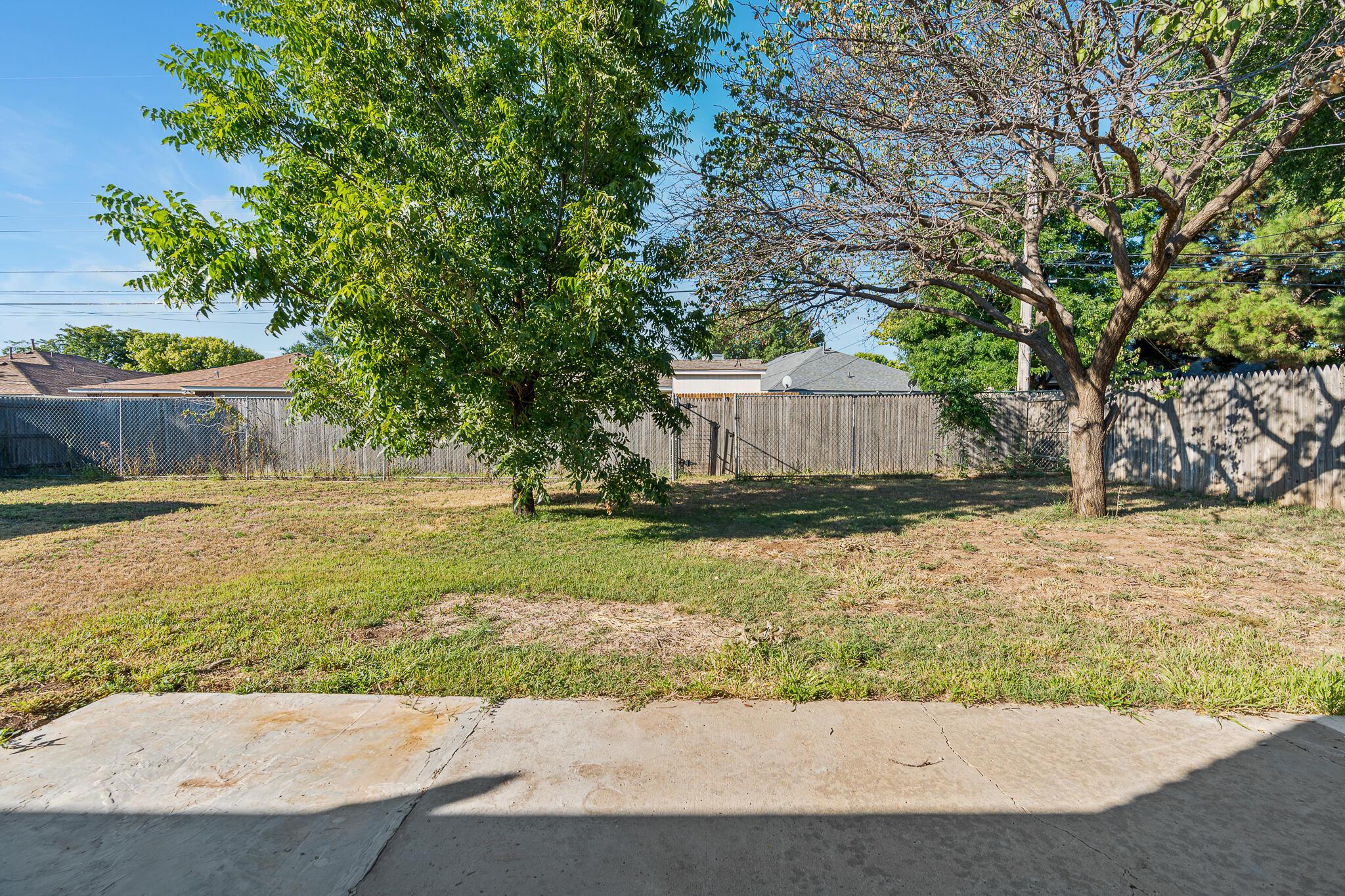 6212 Rutgers Street Amarillo, TX 79109 - Photo 23 of 26 a view of a house with a yard