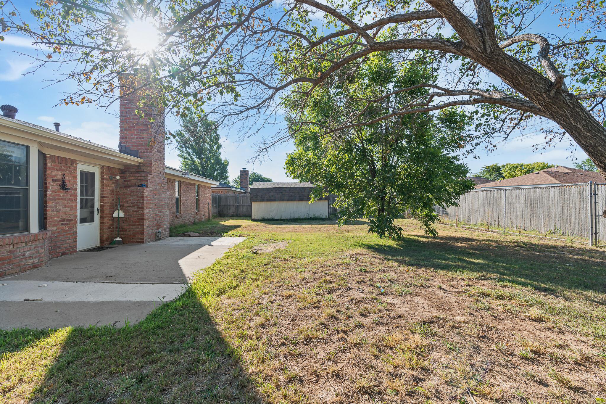 6212 Rutgers Street Amarillo, TX 79109 - Photo 24 of 26 a view of a house with a yard
