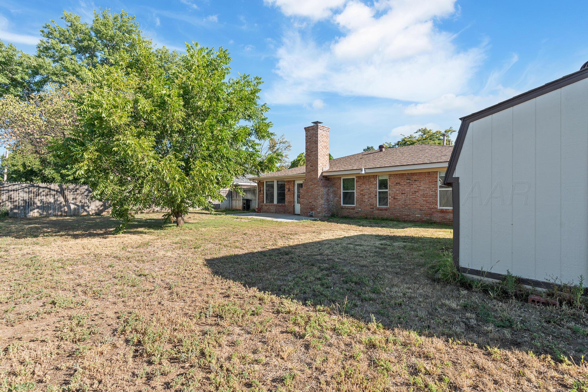 6212 Rutgers Street Amarillo, TX 79109 - Photo 26 of 26 a front view of a house with a yard