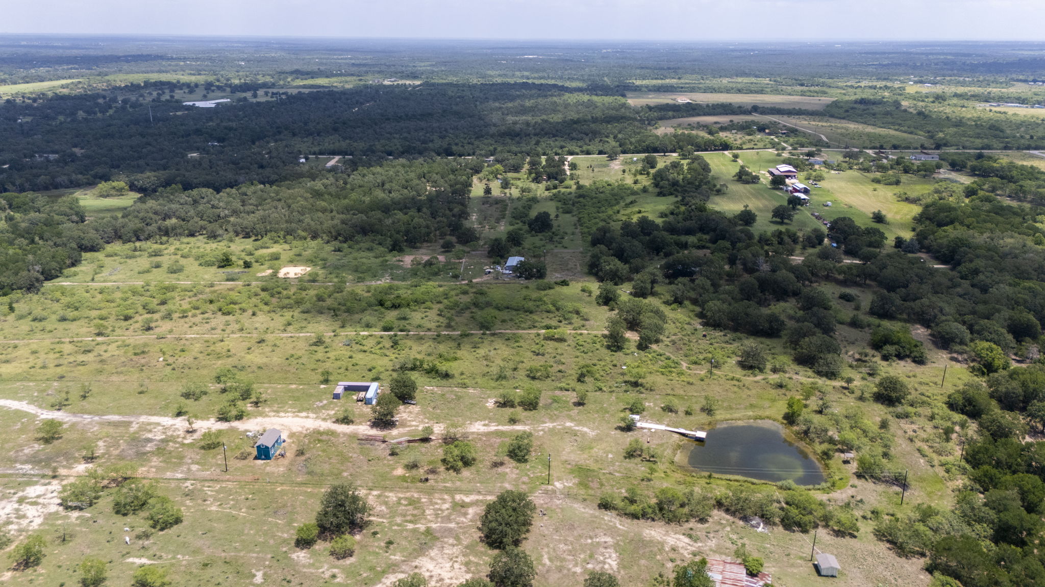 401 Turnback Trail Dale, TX 78616 - Photo 11 of 34 a view of a lake with mountains in the background