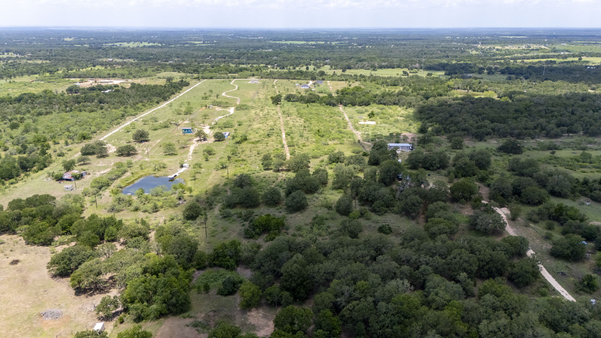 401 Turnback Trail Dale, TX 78616 - Photo 22 of 34 an aerial view of residential houses with outdoor space and swimming pool